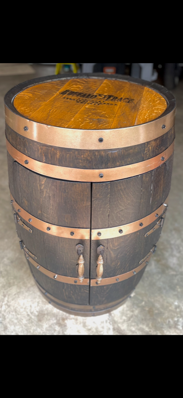 Buffalo Trace branded barrel cabinet with copper bands and ornate drop handles